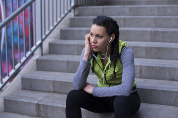 Young sportive woman working out in the city