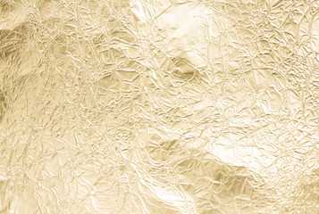 Gold wrinkled paper texture abstract background