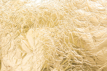 Gold wrinkled paper texture abstract background