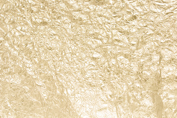 Gold wrinkled paper texture abstract background