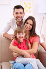 Fototapeta premium Happy family on sofa at home