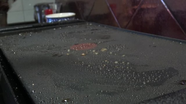 4k, cheff is cooking a Steak in hot Griddle of a kichen, T-bone steak is low fat healthy living meal choice -Dan