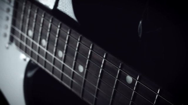 4k Close-up Electric Guitar Strings and Body