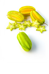 Yellow green star carambola or star apple ( starfruit ) on white background healthy star fruit food...