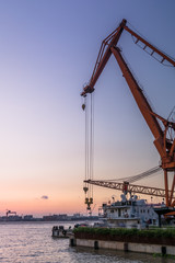 Fototapeta premium Cargo container ship at harbor in city of China.