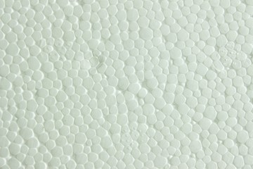 Obraz na płótnie Canvas Polystyrene foam texture. background from the white surface of foam plastic