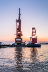 Obraz premium Cargo container ship at harbor in city of China.