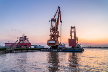 Fototapeta na wymiar Cargo container ship at harbor in city of China.