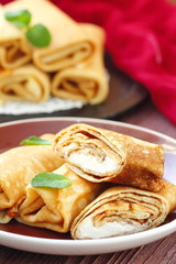 Rolled pancakes with cottage cheese