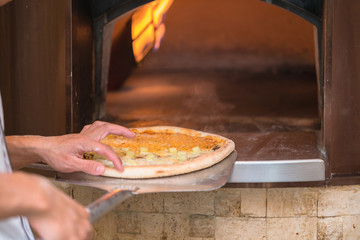 chef baking pizza
