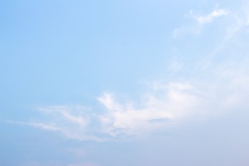 white fluffy clouds in the blue sky .blue sky background with tiny clouds