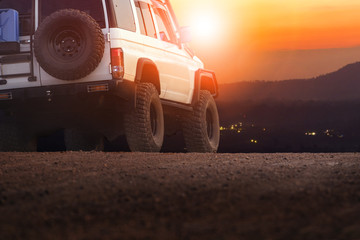 sport offroad vehicle on dirt field against sun set sky for traveling and outdoor lifestyle © stockphoto mania