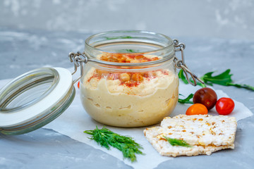 Healthy chickpea hummus in jar with vegetables. Clean eating, vegetarian, raw, detox, dieting concept