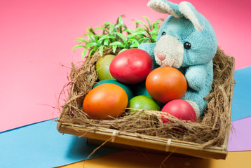 decorating Easter bunny and colorful Easter eggs