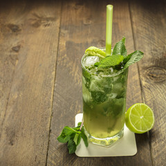 Mojito cocktail with mint leaves and lime