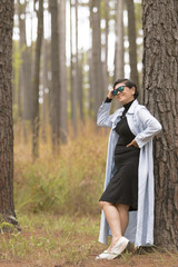 asian woman relaxing emotion toothy smiling in pine forest