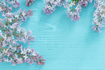 The beautiful lilac on a blue wooden background
