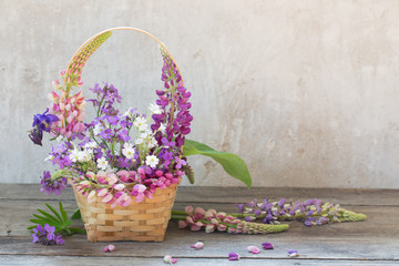 Fototapeta na wymiar still life with summer flowers in basket