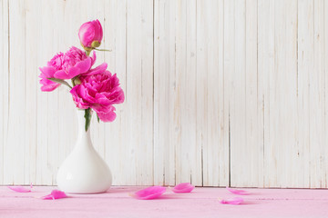 Peony flowers in  vase on white background
