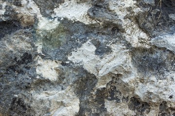 Black stone wall texture background. Gray pattern of rock from nature.