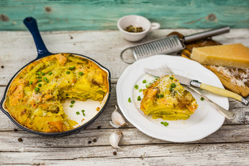 Frittata with potatoes and smoked salmon. Tasty Italian food. 