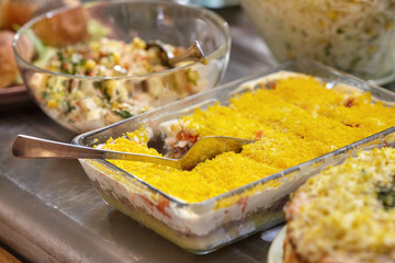 Bowls with various food in self service restaurant