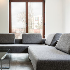 Fototapeta premium Light interior with big windows and sofa