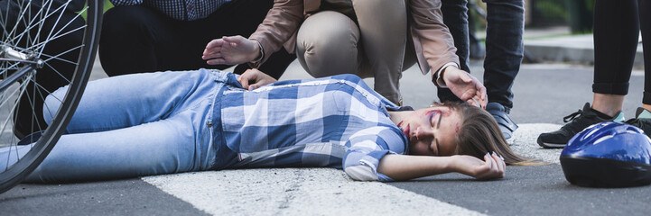 Unconscious accident victim lying on a street