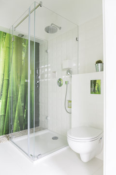 White bathroom with bamboo wallpaper