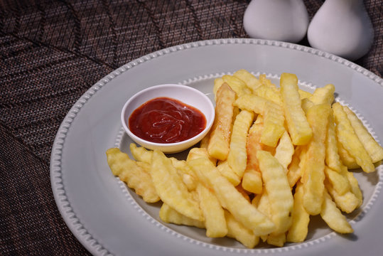 French fries on plate with ketchup