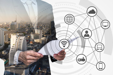 Double exposure of business person and wireless communication network