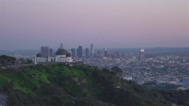Los Angeles Griffith Observatory Sunset left movement following helicopter
