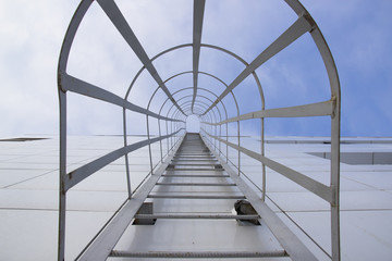 Outdoor fire escape at facade of building in perspective