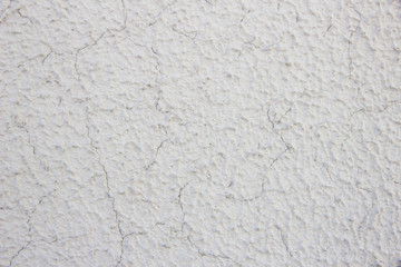 Fototapeta premium Cracks on wall of colored textured paint