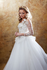 Beautiful girl bride in luxurious wedding dress. Portrait in profile, Regal posture