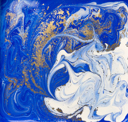 Blue and gold liquid texture. Hand drawn marbling background. Ink marble abstract pattern