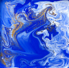 Fototapeta na wymiar Blue and gold liquid texture. Hand drawn marbling background. Ink marble abstract pattern
