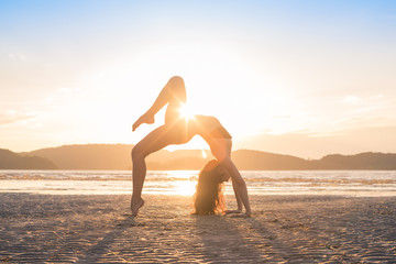 Young Girl Practicing Yoga On Beach At Sunset, Beautiful Woman Summer Vacation Meditation Seaside...