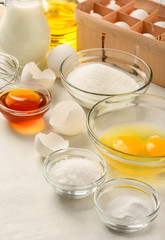 Ingredients for making pancakes on a white background. 