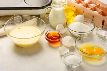 Ingredients for making pancakes on a white background. Copy space.