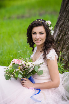 pretty bride in wreath outdoor