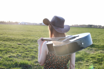 girl outdoor field sunset texas hat