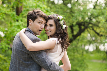 Obraz premium wedding. Couple in spring park. Toned image