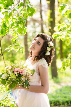 pretty bride in wreath outdoor