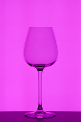 wineglass on purple background