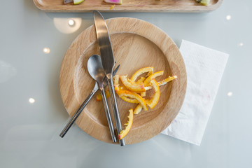 Orange peel in plate after eat dessert