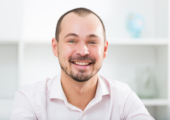 Fototapeta premium Positive young man in office