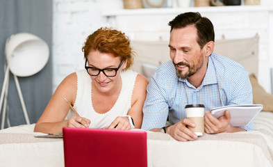 Relaxed couple working at home together