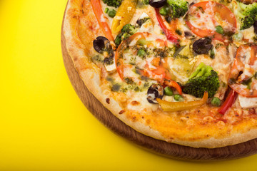 Vegetarian pizza with olives, broccoli, peppers