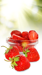 image of ripe strawberry on green blurry background